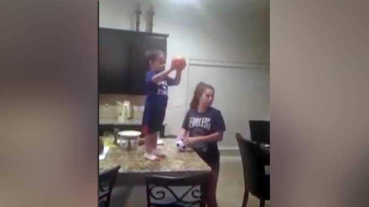 Watch toddler's incredible trick shot ability