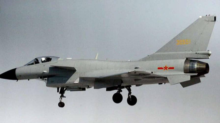 2 armed Chinese jets fly dangerously close to US spy plane