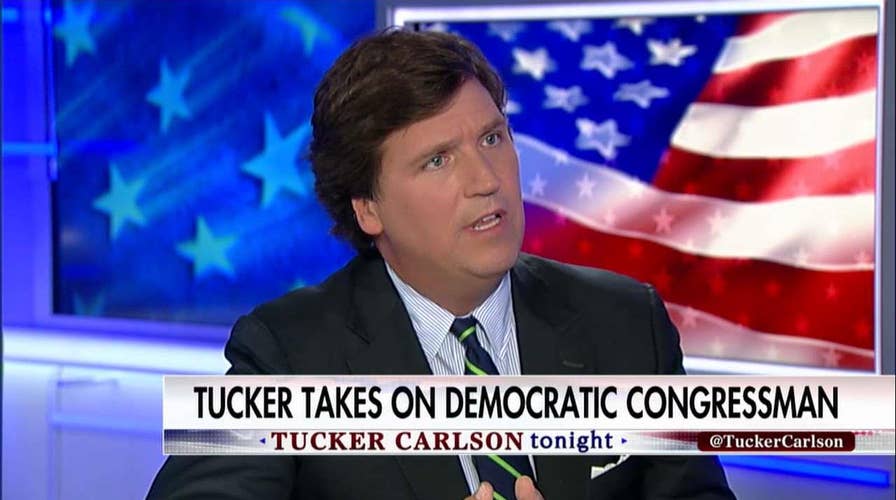 Tucker battles Dem on transgender service ban.