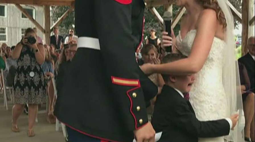 Boy cries as Air Force stepmom shares vows for him, his dad
