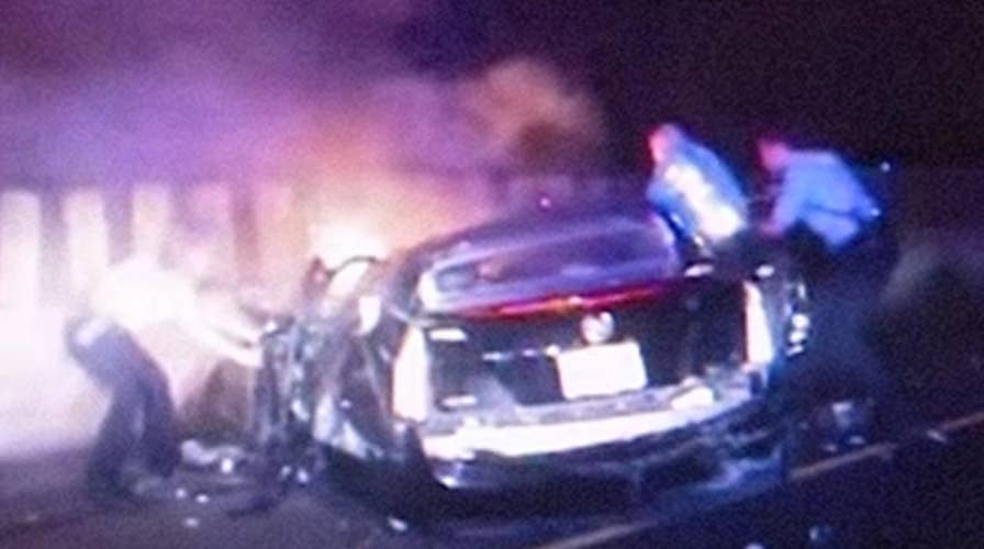 Brave cops, civilians pull occupants from burning car