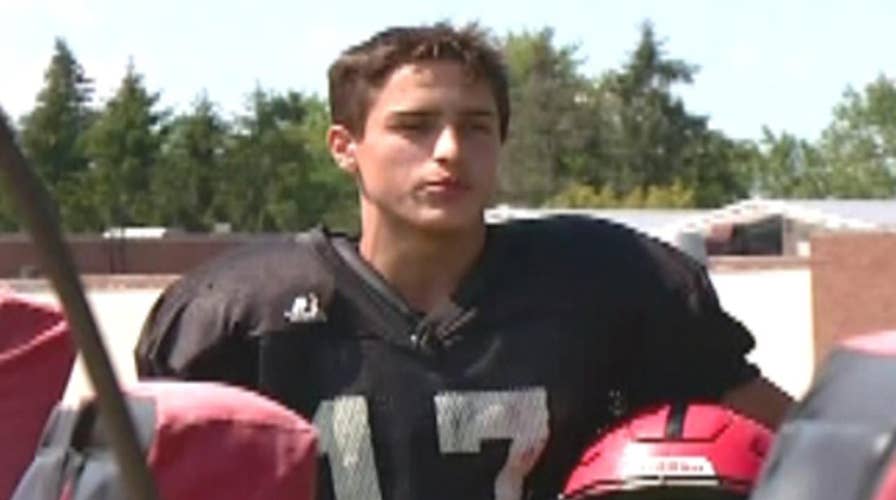 Football team rescues elderly couple from river