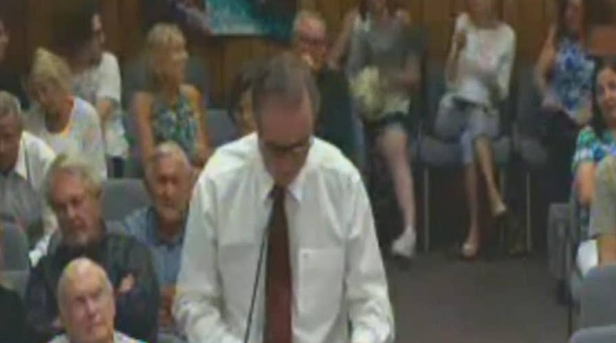 Woman's purse catches fire at city council meeting