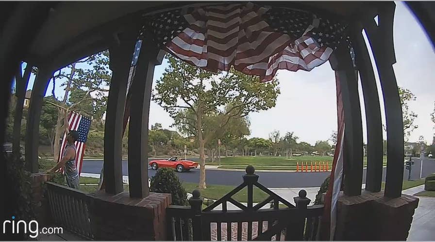 American flag picked up, re-positioned by Good Samaritan