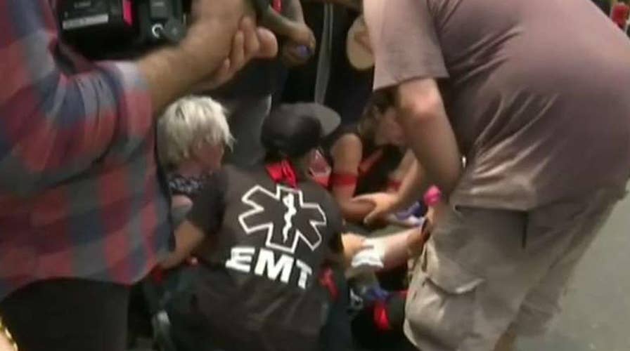 Car drives through crowd of Charlottesville protesters