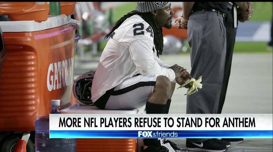 NFL players sit out anthem