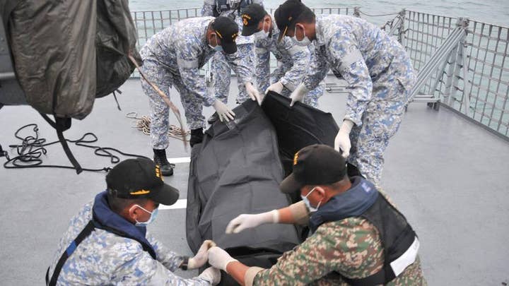 Divers discover remains of Navy sailors on USS McCain