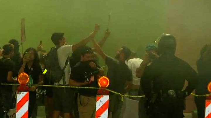 Police use smoke to disperse anti-Trump protesters