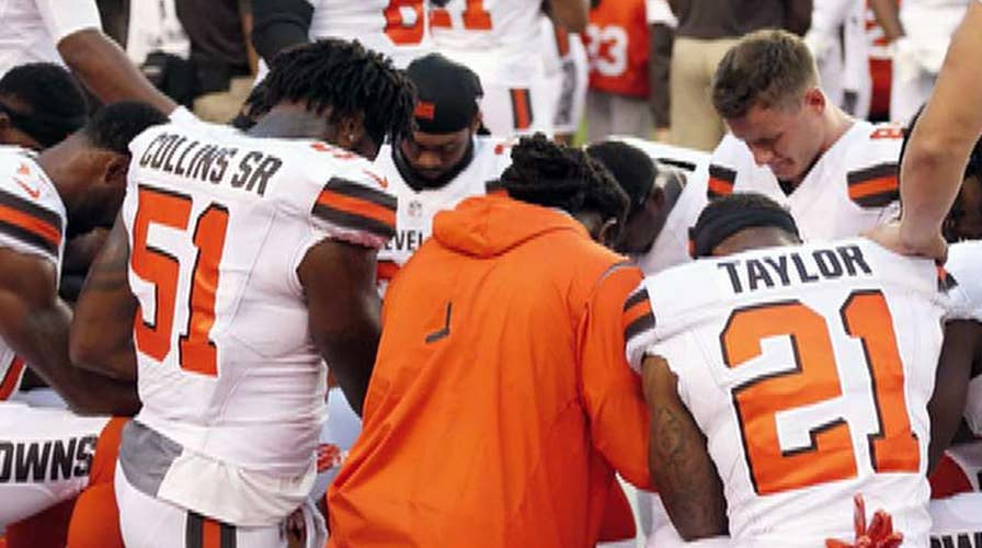 Cleveland Browns players kneel during national anthem