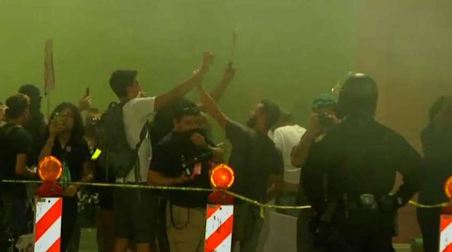 Police use smoke to disperse anti-Trump protesters