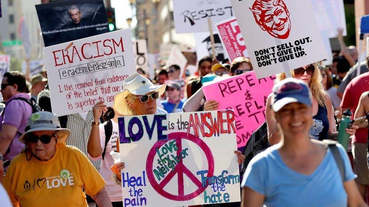 Protests greet President Trump in Phoenix