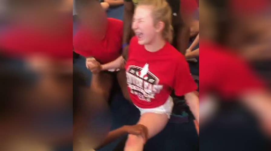 Videos of cheerleaders pushed into splits prompts probe