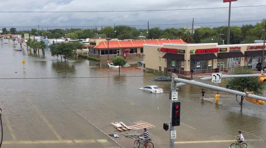 Rescue teams overwhelmed as rain continues in Houston