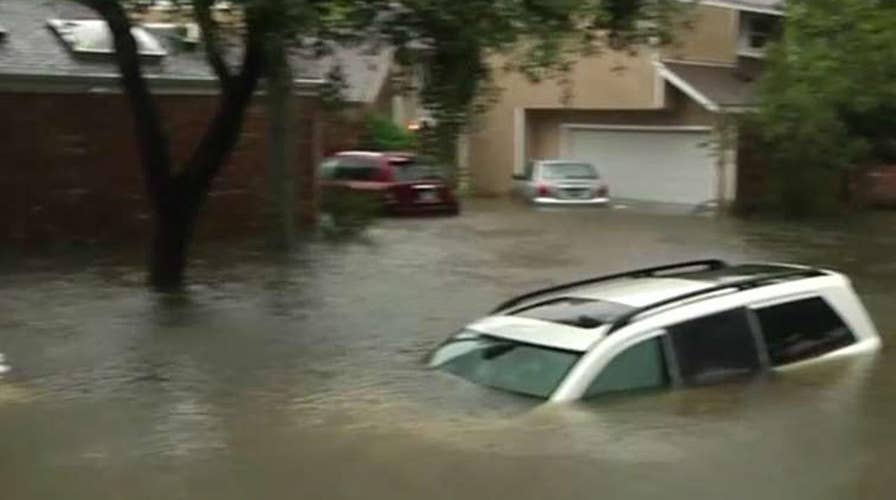 Officials search flooded Houston neighborhoods for victims