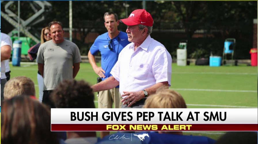 George W. Bush speaks to SMU players after Hurricane Harvey