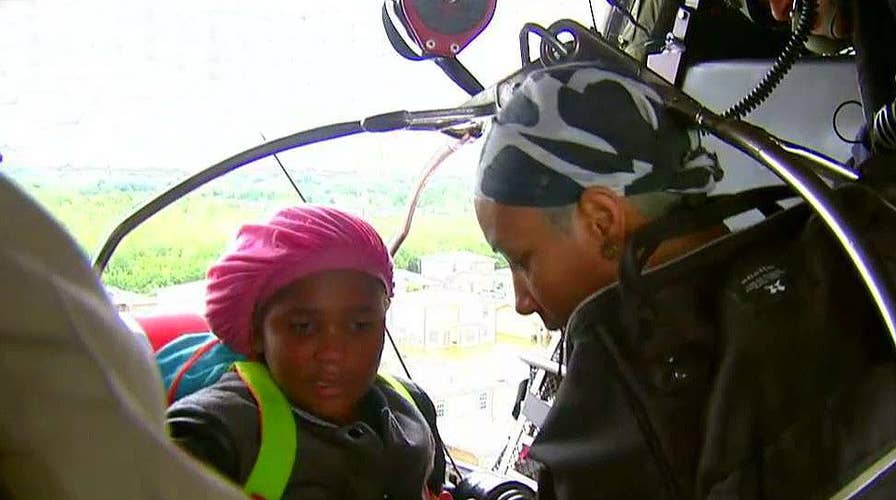 Helicopter crew plucks Beaumont family to safety