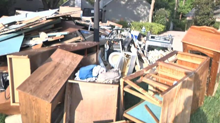 Houston homeowners cleaning up, battling looters