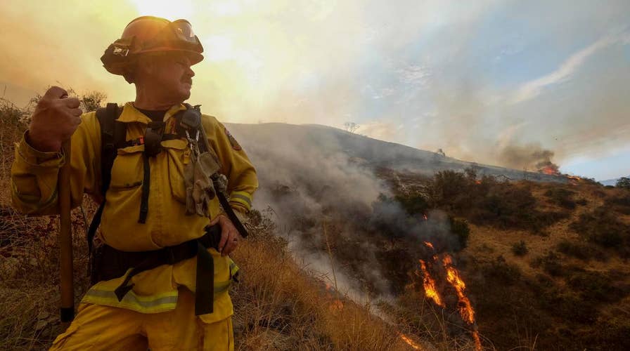 Crews fight to contain massive wildfires in Calif., Oregon