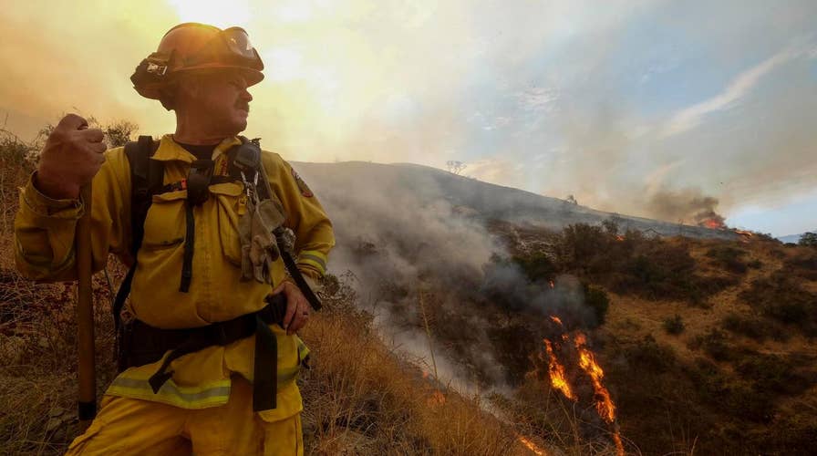 Crews fight to contain massive wildfires in Calif., Oregon