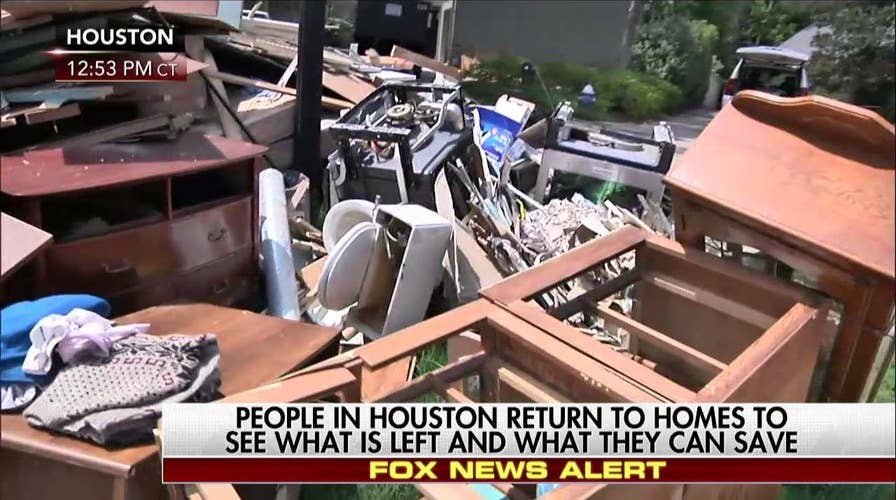 People in Houston return to homes to see what they can save
