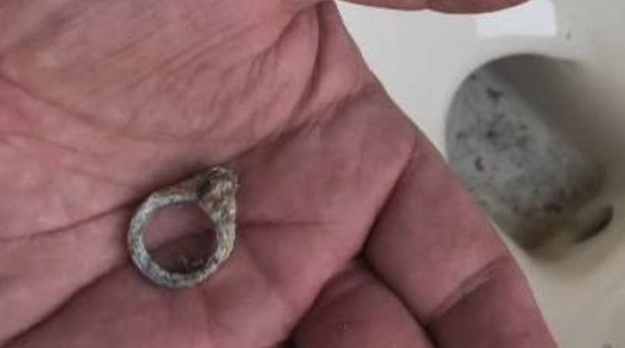 Couple finds long lost wedding ring in toilet during remodel