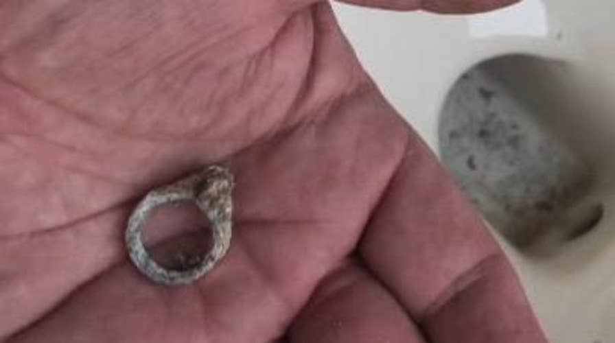 Couple finds long lost wedding ring in toilet during remodel