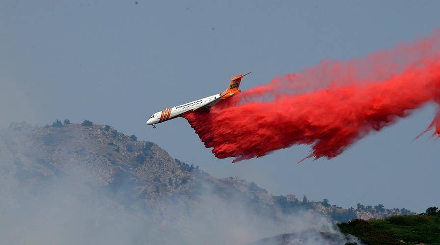 Nearly 100 wildfires burning out west