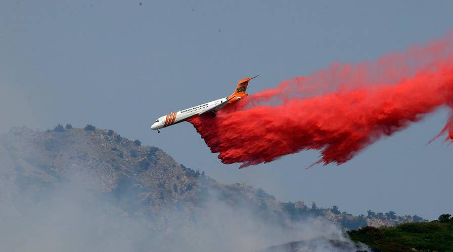 Nearly 100 wildfires burning out west