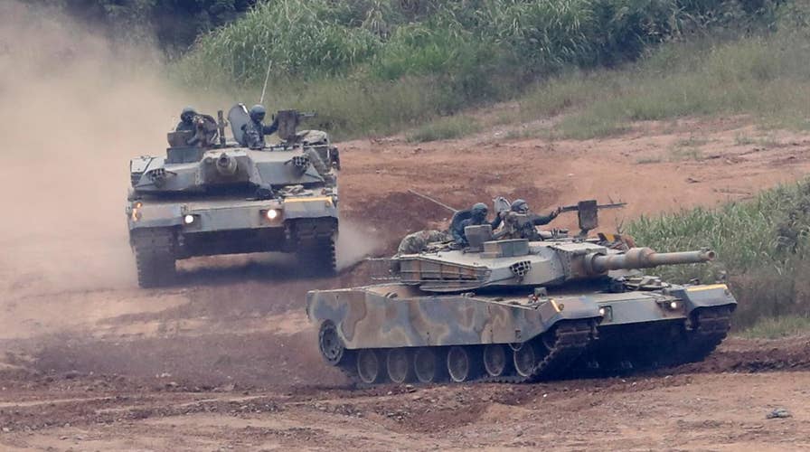 South Korea enhances defenses as residents watch and wait