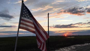 Georgia officers rescue fallen American flag from Irma floodwaters