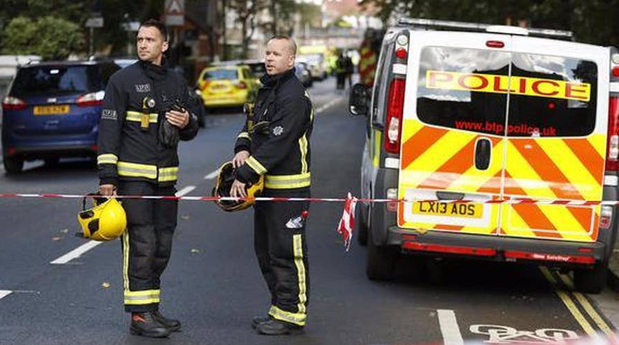 Terror attack on London train ignites manhunt