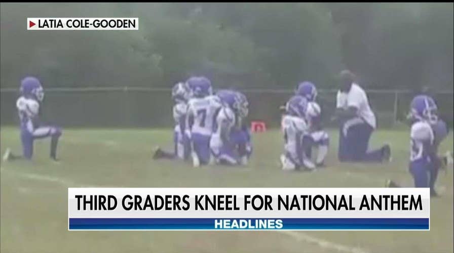 8-year-old football players kneel during anthem