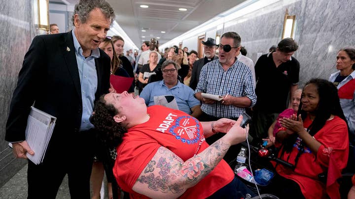 Protesters removed from Senate health care reform hearing