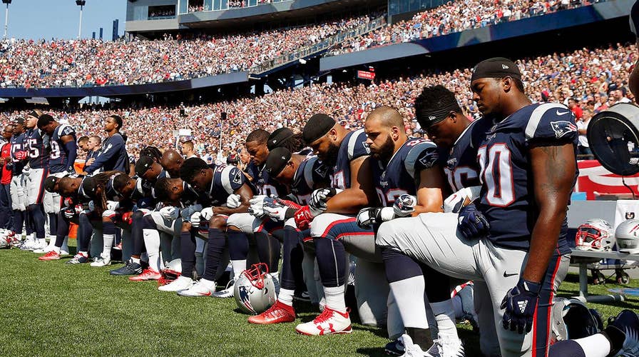 Politics and sports collide as anthem protests sweep NFL