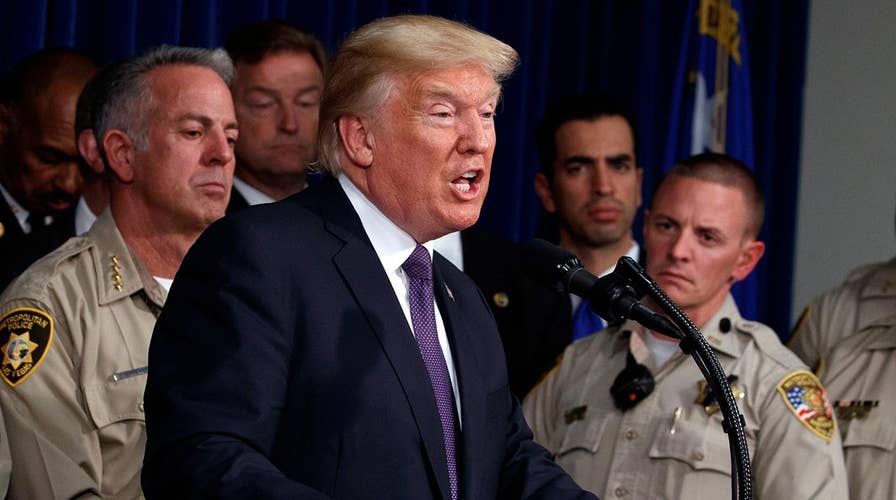 Trump pays tribute in Vegas, dodges gun control debate