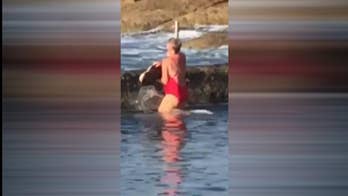 Australian woman wrangles shark with bare hands out of pool, video shows