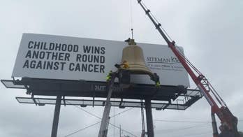 Billboard featuring chemo bell to ring every time child finishes treatment