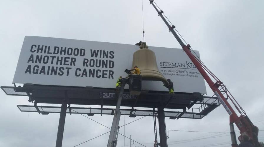 Billboard with chemo bell rings when child ends treatment