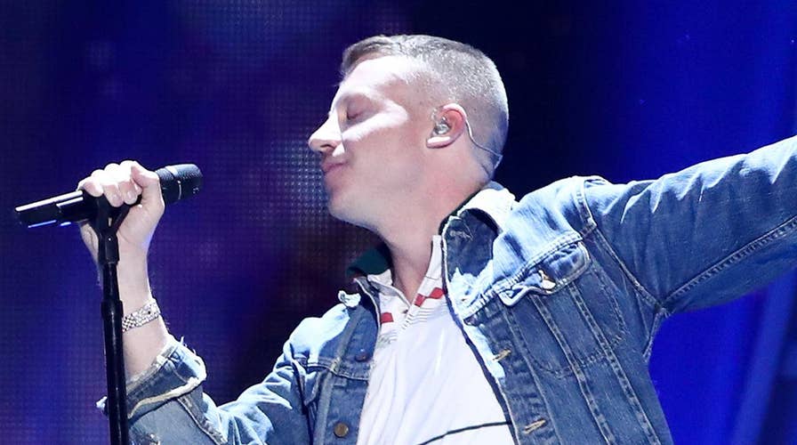 Macklemore leads crowd in anti-Trump chant