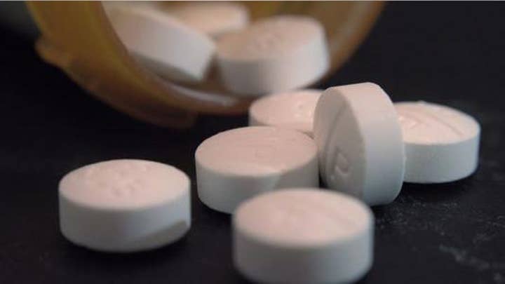 Was the opioid crisis fueled by the drug industry, Congress?