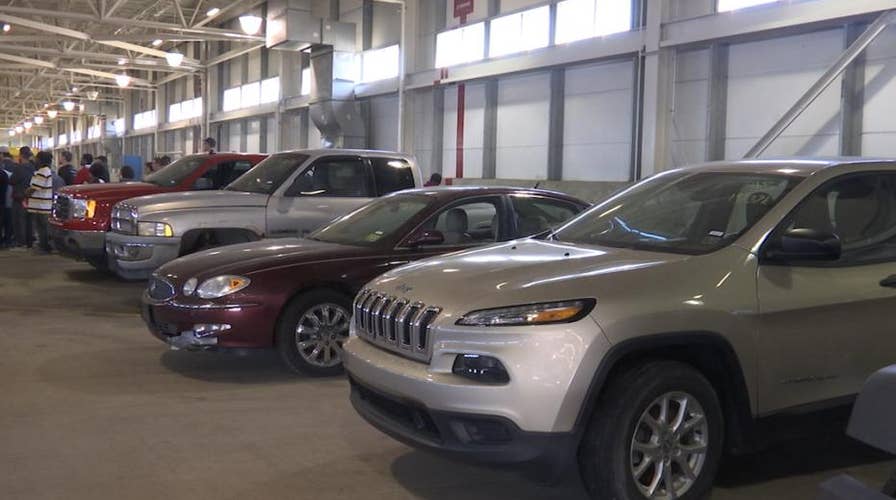 Airport auctions off lost and found items, abandoned cars