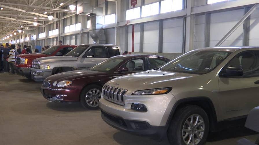 Airport auctions off lost and found items, abandoned cars