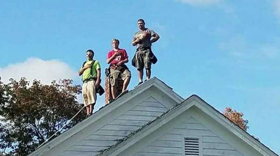 Roofers in Maine stop work to respect national anthem, flag