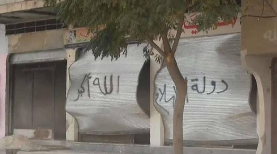 Syrian activists say 65 bodies found in town held by ISIS