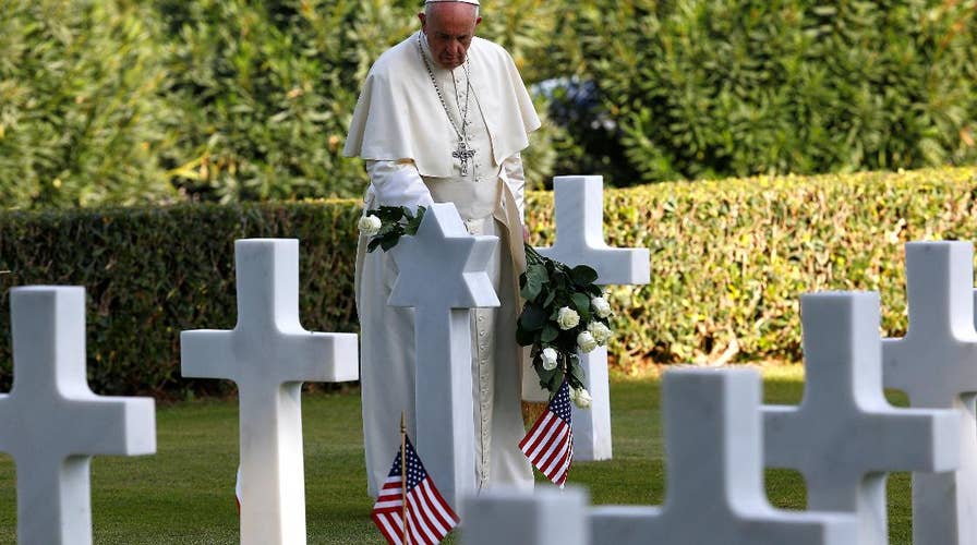 Pope Francis visits an American military cemetery on All Souls’ Day