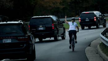 Woman who flipped off presidential motorcade sues former company that fired her
