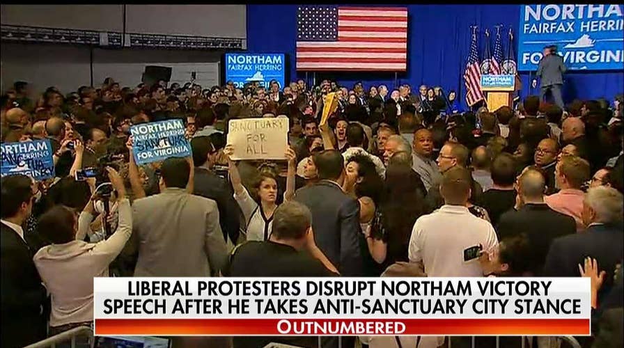 Liberal protesters disrupt Northam victory speech