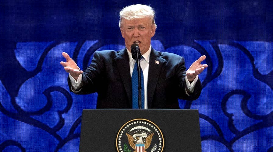 Trump warns trading partners to play by the rules in Vietnam