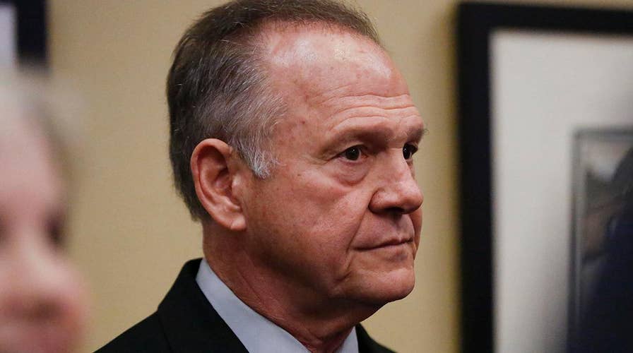 Roy Moore remains defiant as fifth accuser goes public