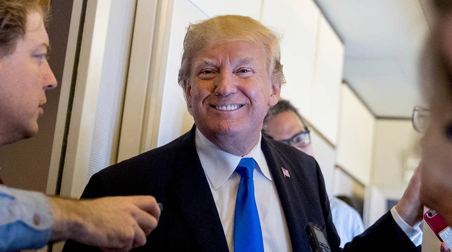 Trump heads home from Asia as he promises big announcement